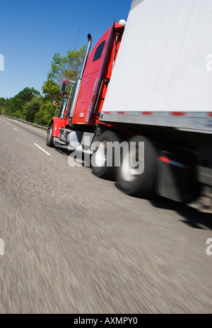 Side angle view of tractor trailer on highway Stock Photo