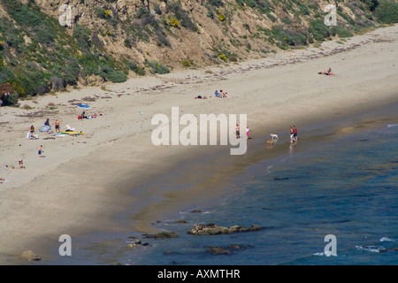 Bathers on the beach in Malibu, CA Stock Photo