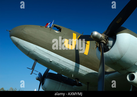 Old airplane Douglas DC-3 Dakota (C-47) with a french flag on the cockpit during a french vintage airshow at La Ferte Alais Stock Photo