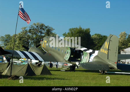 WWII scene of cargo/troops plane Douglas C-47 Dakota (DC-3) and us army campground, La Ferte Alais air show, France Stock Photo