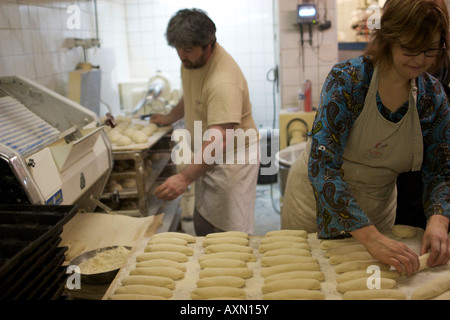 Baker Jacques Langlois and wife Jocelyne making bread at his bakery on rue Beauvoisine in Rouen, Seine-Maritime, France. Stock Photo