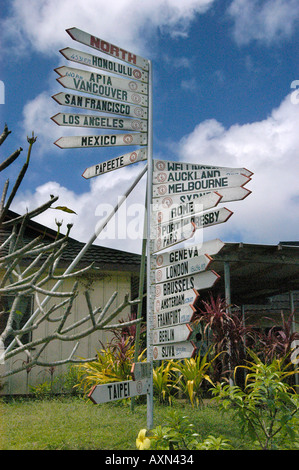 Multidirectional crossroads sign in Tonga pointing to many international cities Stock Photo