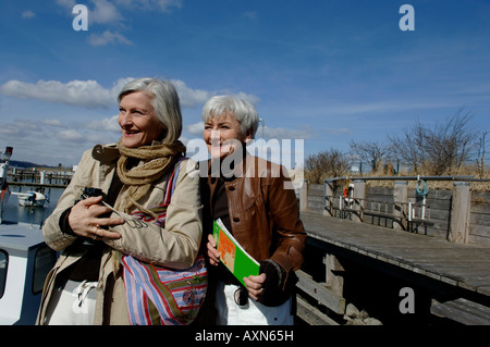 Two mature women looking over the Baltic Sea Stock Photo