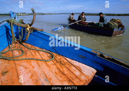 Small boats on the Moulay Bousselham lagoon Morocco Stock Photo