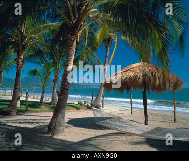 Hammock on the Mexican beach Bahia de Banderas Banderas Bay Stock Photo