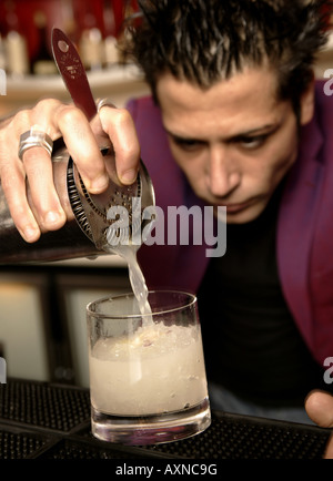 bartender pouring a cocktail Stock Photo
