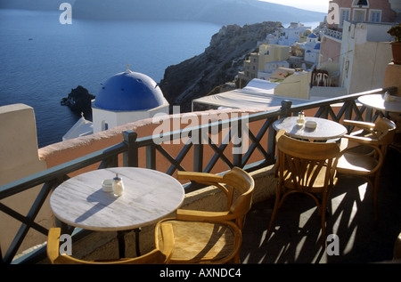 View from a restaurant over the domed churches and rooftops to the caldera at Oai Santorini the Cyclades Greece Stock Photo