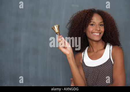 Mixed race woman in front of a blackboard, close-up Stock Photo