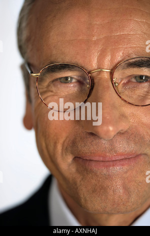 Portrait of a senior businessman wearing spectacles Stock Photo