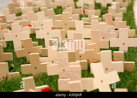 A memorial of wooden crosses and red poppies commemorating the end of World War I on Remembrance Day Stock Photo