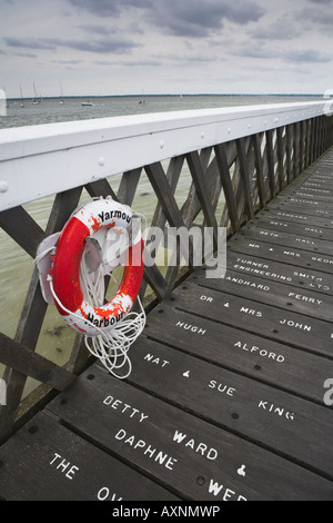 Names engraved on the refurbished Yarmouth Pier on the Isle of Wight Stock Photo