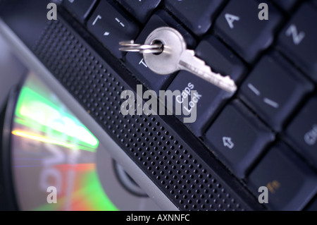 Key by Caps lock button on laptop keyboard security digital risk management Stock Photo