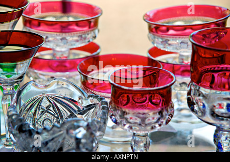Display of antique glassware on sale at an antique shop Stock Photo