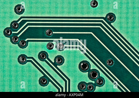 Underside of an integrated circuit board showing the etched connections between components. Stock Photo