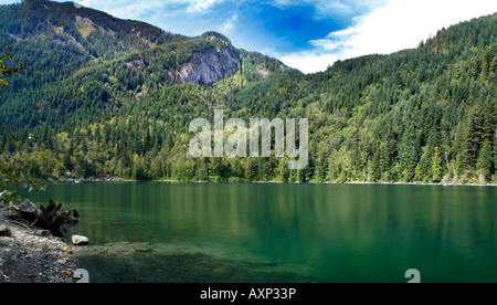 The mirrored reflection of the surroundning mountains at the Lake in the woods, near Hope, British Columbia, Canada Stock Photo