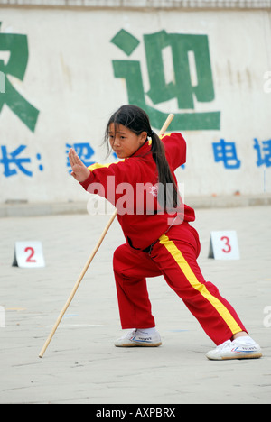 Girl training in Martial Arts Kung Fu at Shaolin Martial Arts School the largest Martial Arts School in China Near Shaolin Stock Photo