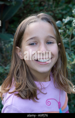 young girl smiling cheekily Stock Photo - Alamy