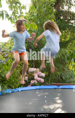 children bouncing on trampoline Stock Photo - Alamy