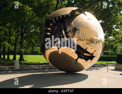 The gold 'Sphere within a Sphere' by Arnaldo Pomodoro in the grounds of the UN complex in New York City USA