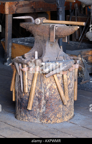 Blacksmith anvil and tools Stock Photo