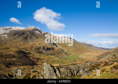 View down Nant Ffrancon valley with snow on mountains in Snowdonia National Park in winter. Ogwen Gwynedd North Wales UK Britain Stock Photo