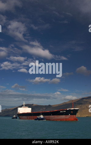 An empty bulk carrier arrives in port to load a full cargo of coal Stock Photo