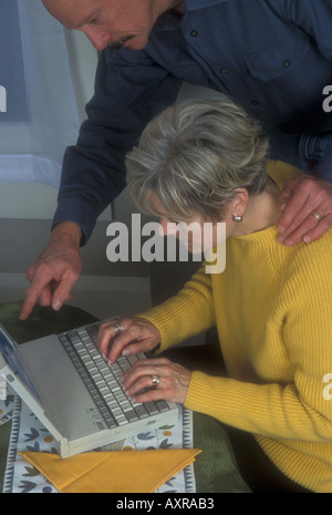 Man Helping Woman with Computer Stock Photo