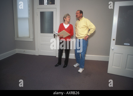 Couple Examining a Room Stock Photo
