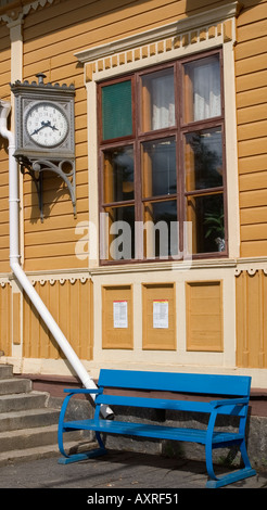 Empty blue wooden bench for passengers waiting for the train at Suonenjoki railway station Finland Stock Photo