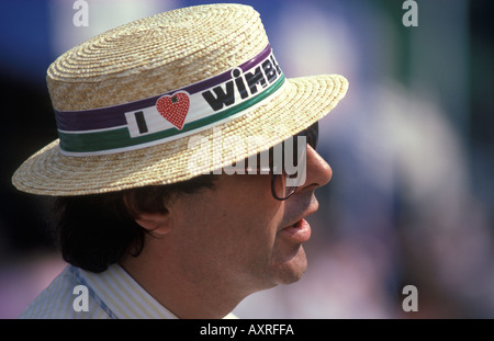 Wimbledon tennis fan London SW19 England. I love Wimbledon heart shape strawberry design logo on the hat bane of a straw boater. 1980s UK HOMER SYKES Stock Photo