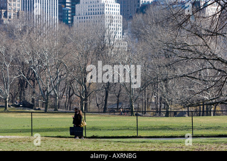 A couple walk across Central Park in Manhattan, New York. Stock Photo