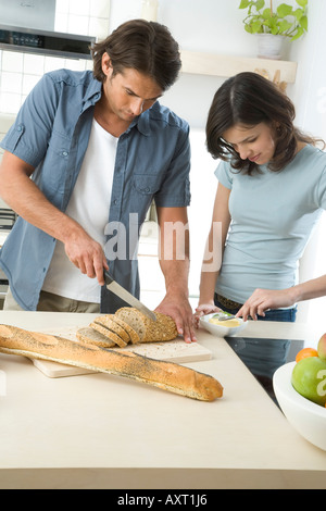 couple preparing breakfast in kitchen Stock Photo