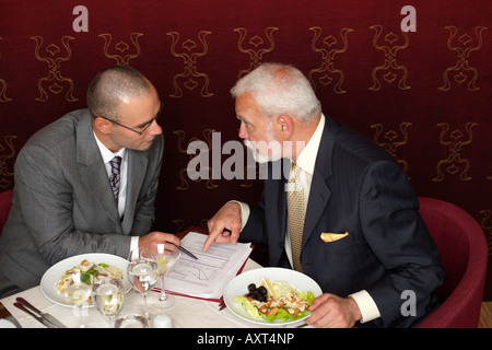 Two businessmen having a business lunch Stock Photo