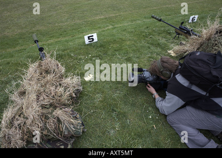 British Army Infantry soldiers demonstrate their newest L115A3 sniper rifle on firing ranges to filming TV media Stock Photo