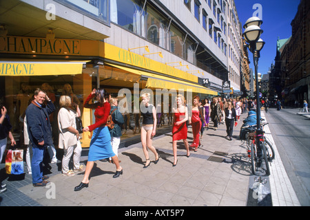 Fashion models and pedestrians on streets of Stockholm at Normalmstorg in summer Stock Photo