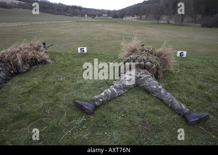 Infantry soldiers of the British Army demonstrate their newest L115A3 sniper rifle on firing ranges of the Support Weapon School Stock Photo