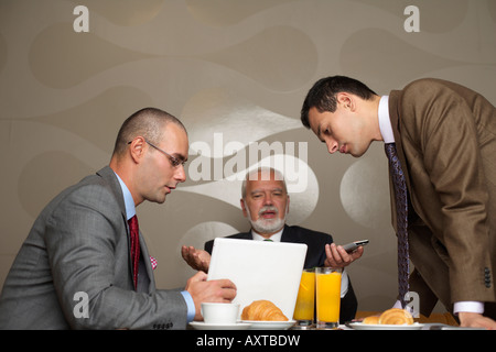 Three businessmen having a meeting Stock Photo