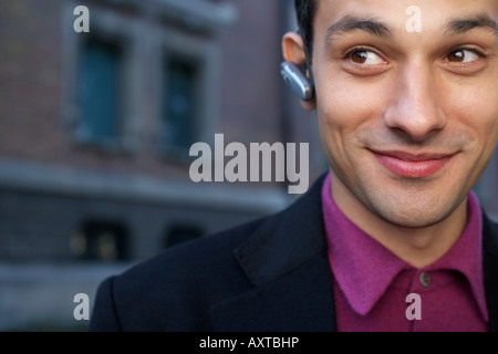 Smiling businessman using a headset Stock Photo
