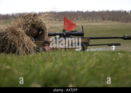 British Army Infantry soldiers demonstrate their newest L115A3 sniper rifle on firing ranges of the Support Weapon School UK Stock Photo