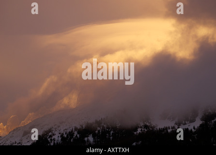 Golden lenticular storm clouds forming over Aiguille Verte and the Drus, Chamonix-Mont Blanc, France Stock Photo