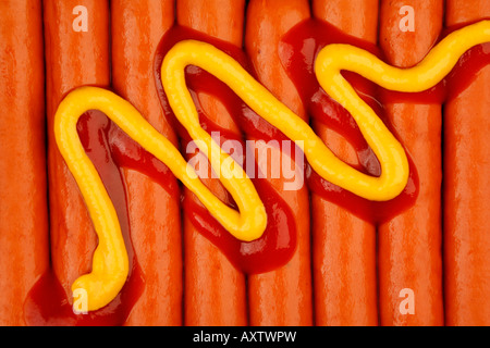 Mustard and ketchup on hot dog sausages Stock Photo