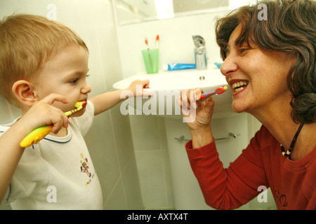 A little boy is learning to clean teeth Stock Photo