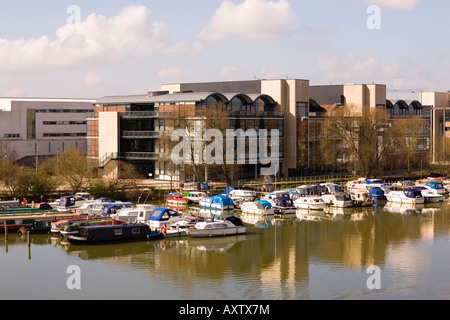 Boats moored in Brayford marina with Lincoln University buildings over Brayford Pool, Lincoln, England Stock Photo