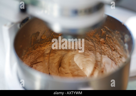 Making chocolate cream using kitchen mixer Stock Photo