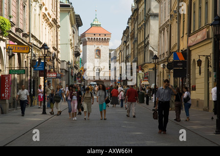 Looking down Florianska street towards the Barbican and Florian's Gate on the old city walls, Krakow (Cracow), Poland Stock Photo
