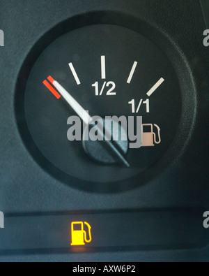 fuel gauge consept running on empty warning cation light Stock Photo