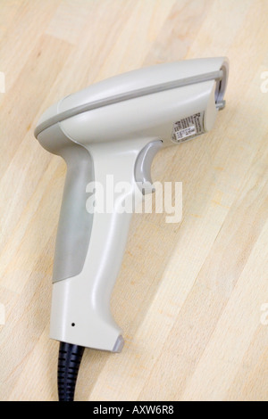 laser barcode reader gun on wooden background Stock Photo