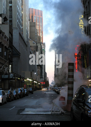 Steam rising from hot road Stock Photo - Alamy