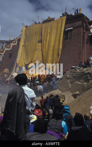 Tibetan Buddhist ceremonial thangka being unveiled at Ganden gompa monastery Tibetan Plateau Tibet China Stock Photo