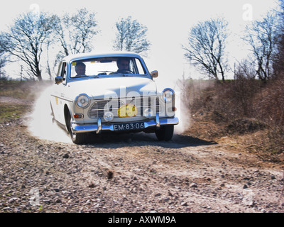 white rally Volvo Amazon 123 at speed on gravel road International Horneland Rally Netherlands Stock Photo